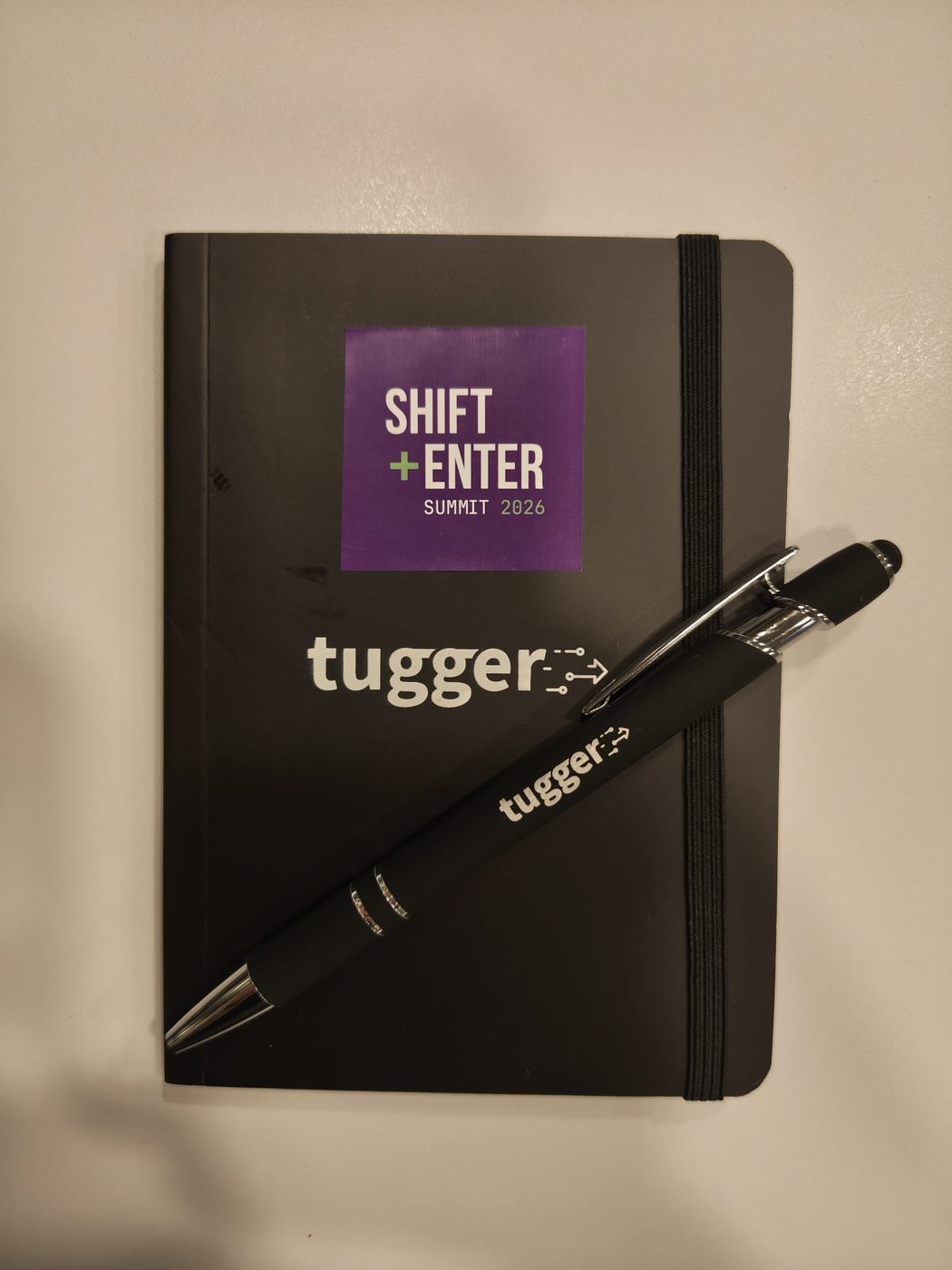 Tugger notebook and pen